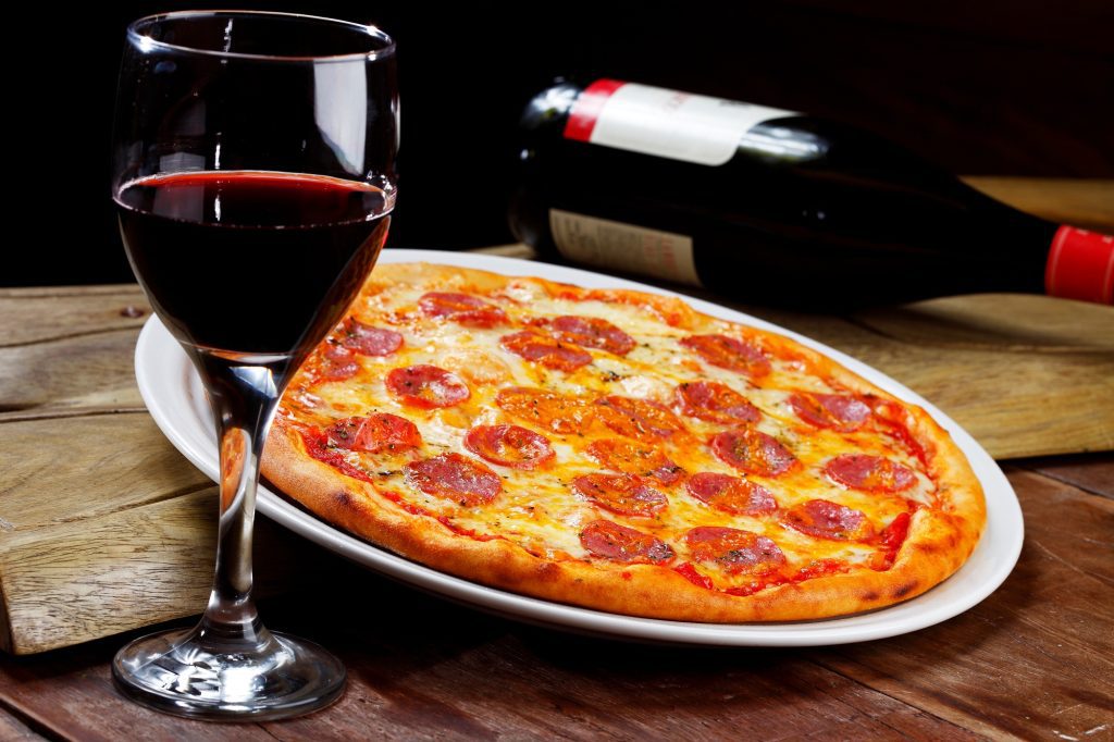 Pepperoni pizza and red wine at Sal’s Pizza Cafe, Gulf Breeze Florida