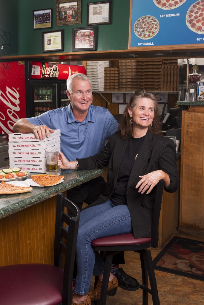 Owners enjoying New York style pizza at Sal’s Pizza Cafe in Gulf Breeze Florida